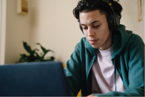 a man using vid2mp3 on a laptop